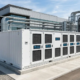 A UL 1973 certified commercial energy storage solution with liquid-cooled battery cabinets installed outdoors on a concrete platform.
