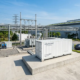 A turnkey 1MW battery storage for industrial manufacturing system installed outdoors on a concrete pad.