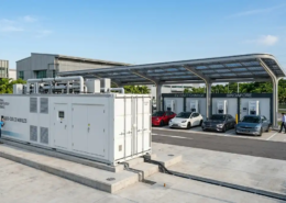 An outdoor 1MW battery storage system enclosure integrated at an EV charging site.