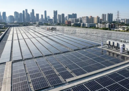 High-efficiency industrial solar panels installed on a flat roof for commercial rooftop solar systems.