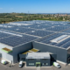 Containerized LFP battery energy storage systems integrated with a turnkey solar farm for smart load shifting.