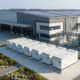 Outdoor BESS cabinets and rooftop solar arrays demonstrating the financial benefits of solar battery storage for an industrial facility.
