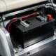 A 48v golf cart batteries pack retrofitted in the aluminum battery bay under the seat of a custom electric vehicle