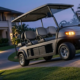 Commercial utility cart powered by a 48v golf cart battery climbing a steep paved resort pathway