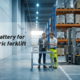 Procurement manager evaluating an electric forklift and industrial battery options in a warehouse