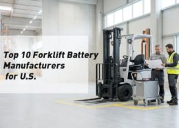Fleet manager and battery engineer comparing forklift battery systems in a bright U.S. warehouse
