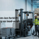 Engineer assessing a lead-acid forklift before lithium-ion battery conversion